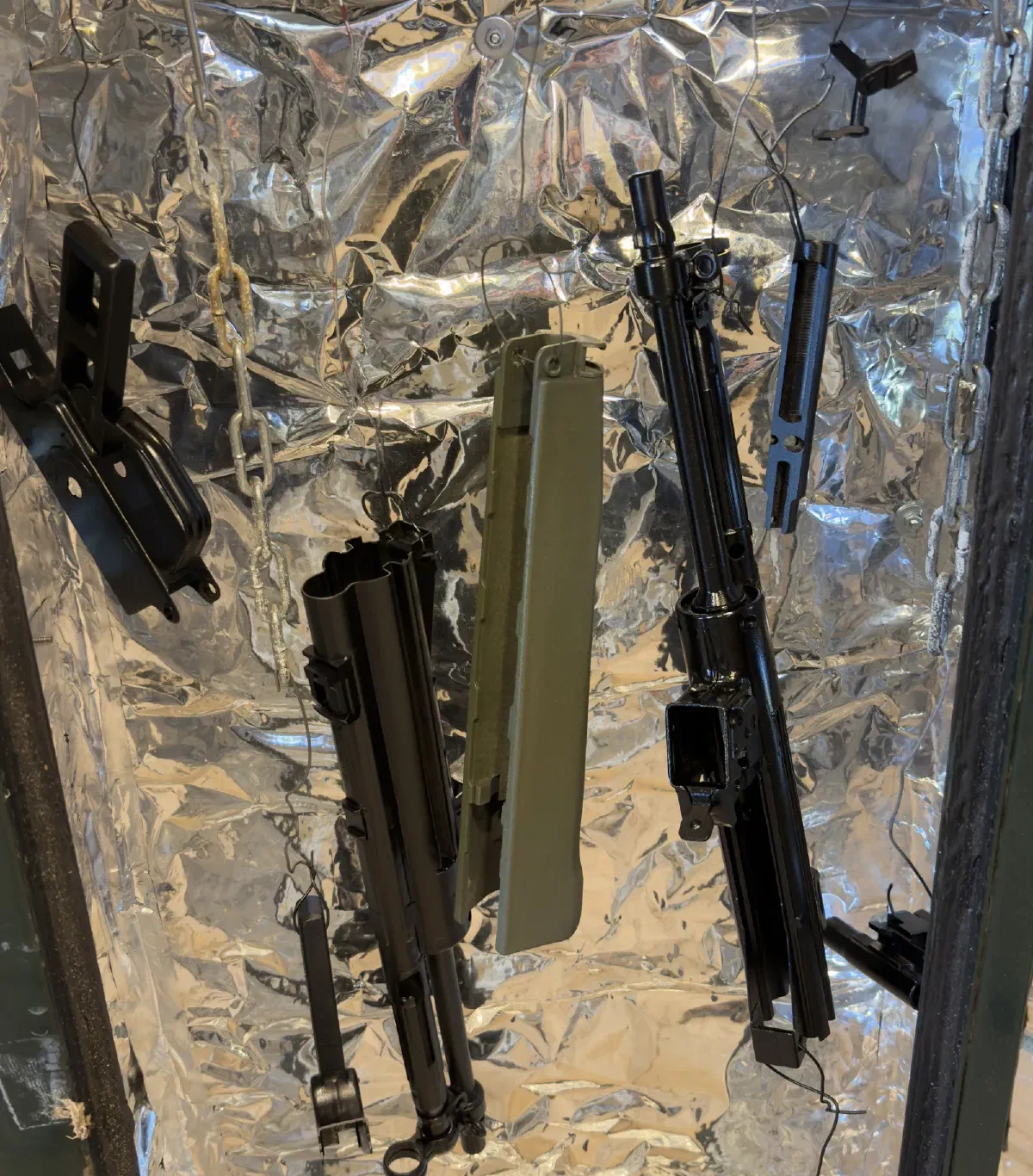 Coated parts hanging in the cure oven